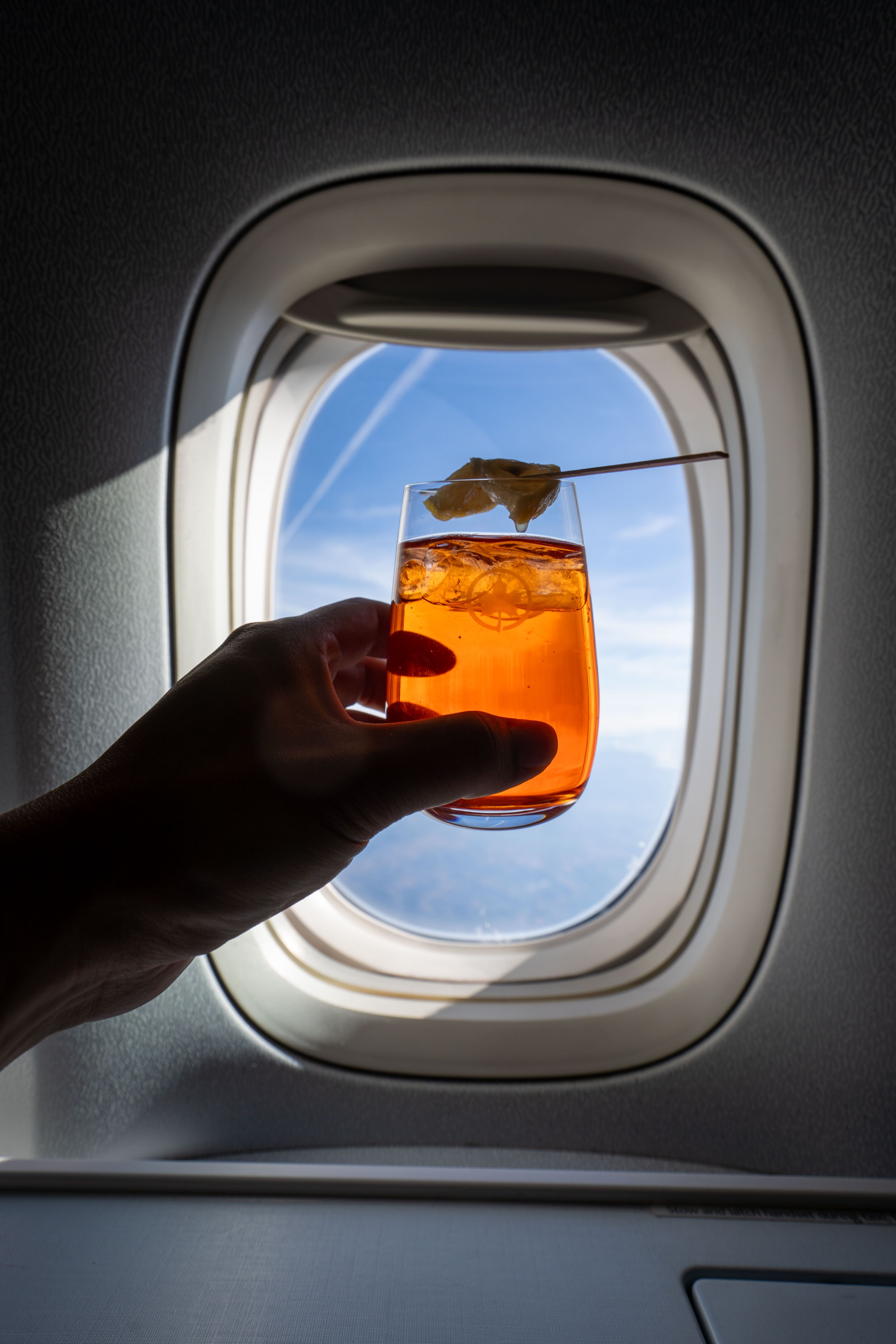Cocktail by airplane window